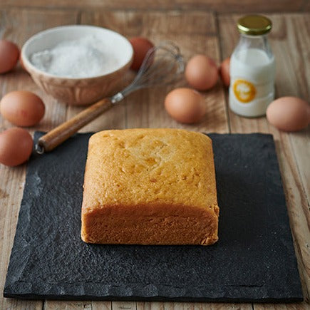 a plain square 6 inch vanilla sponge cake 