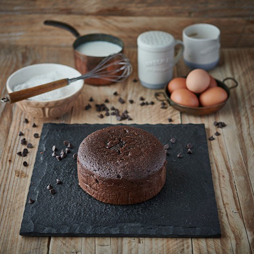 6 inch round chocolate sponge cake ready to decorate