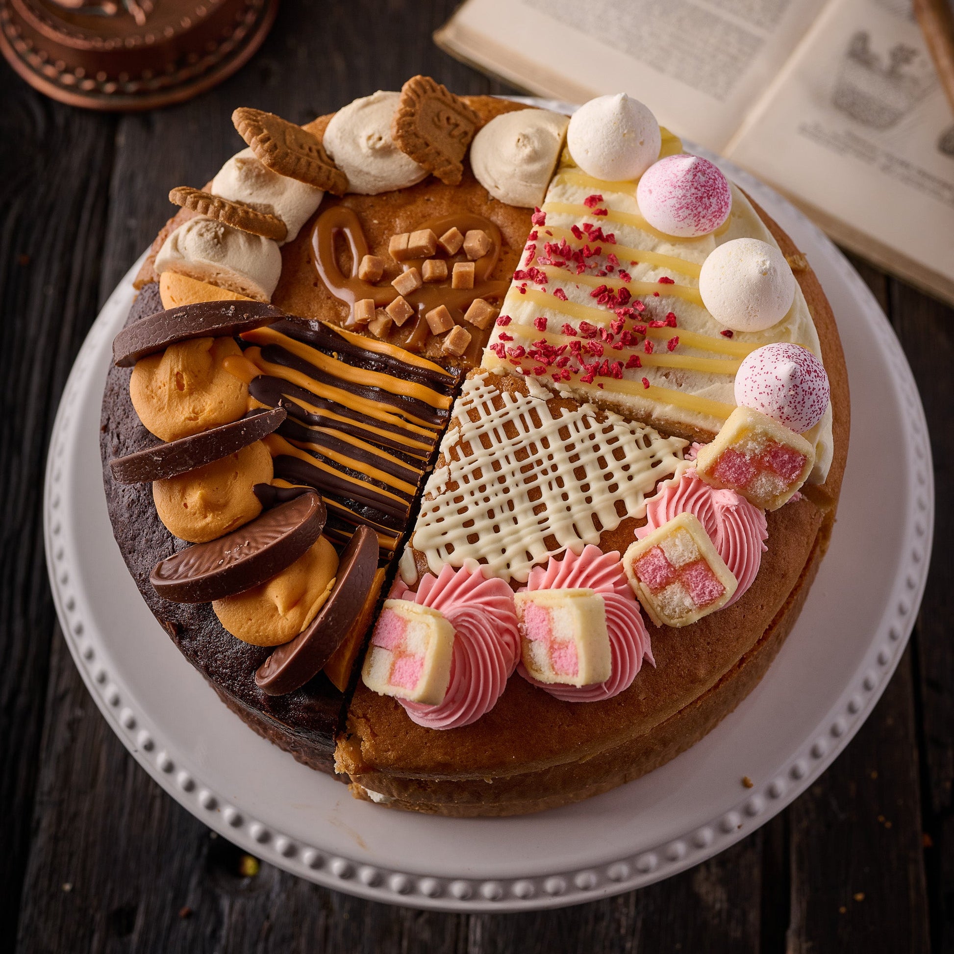 10 inch sharing cake with four flavours including Biscoff, chocolate orange, raspberry lemon meringue and battenberg try different flavours of cake 